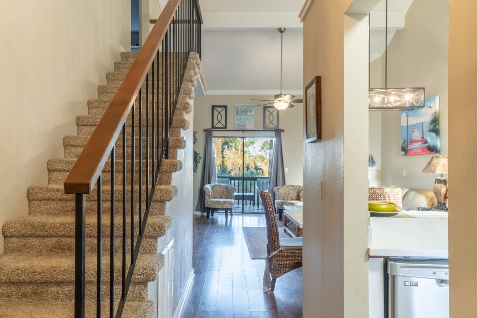 A large open staircase leads to the second floor.