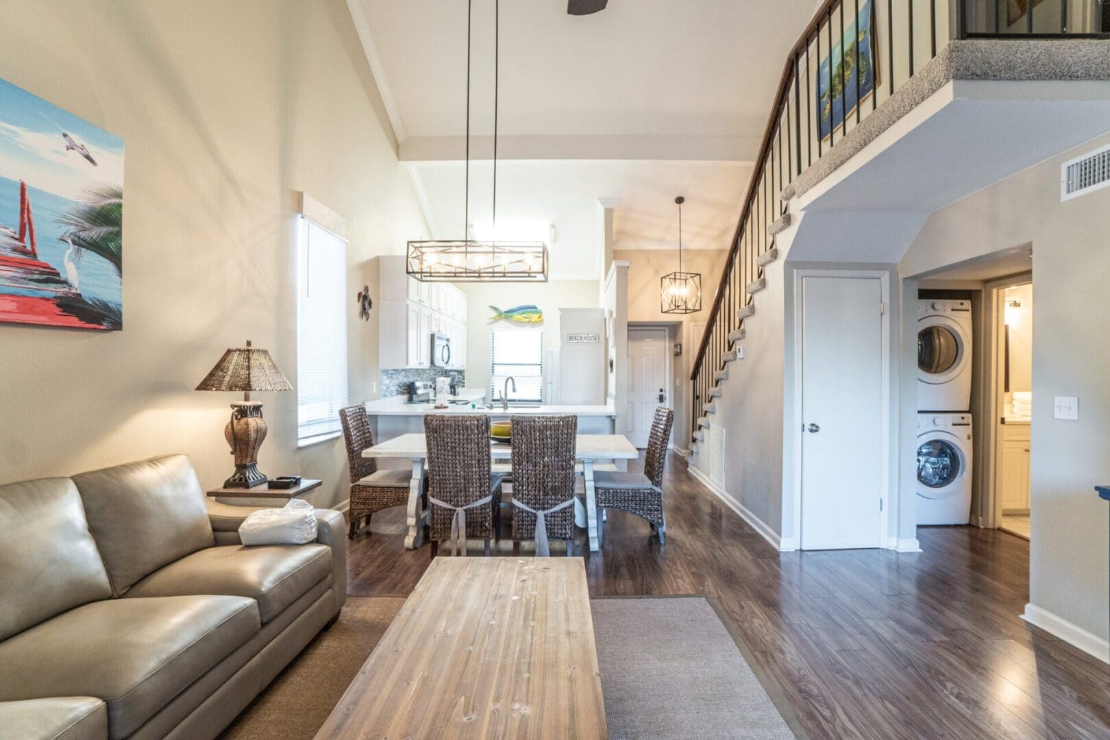 A living room with a table and chairs in it