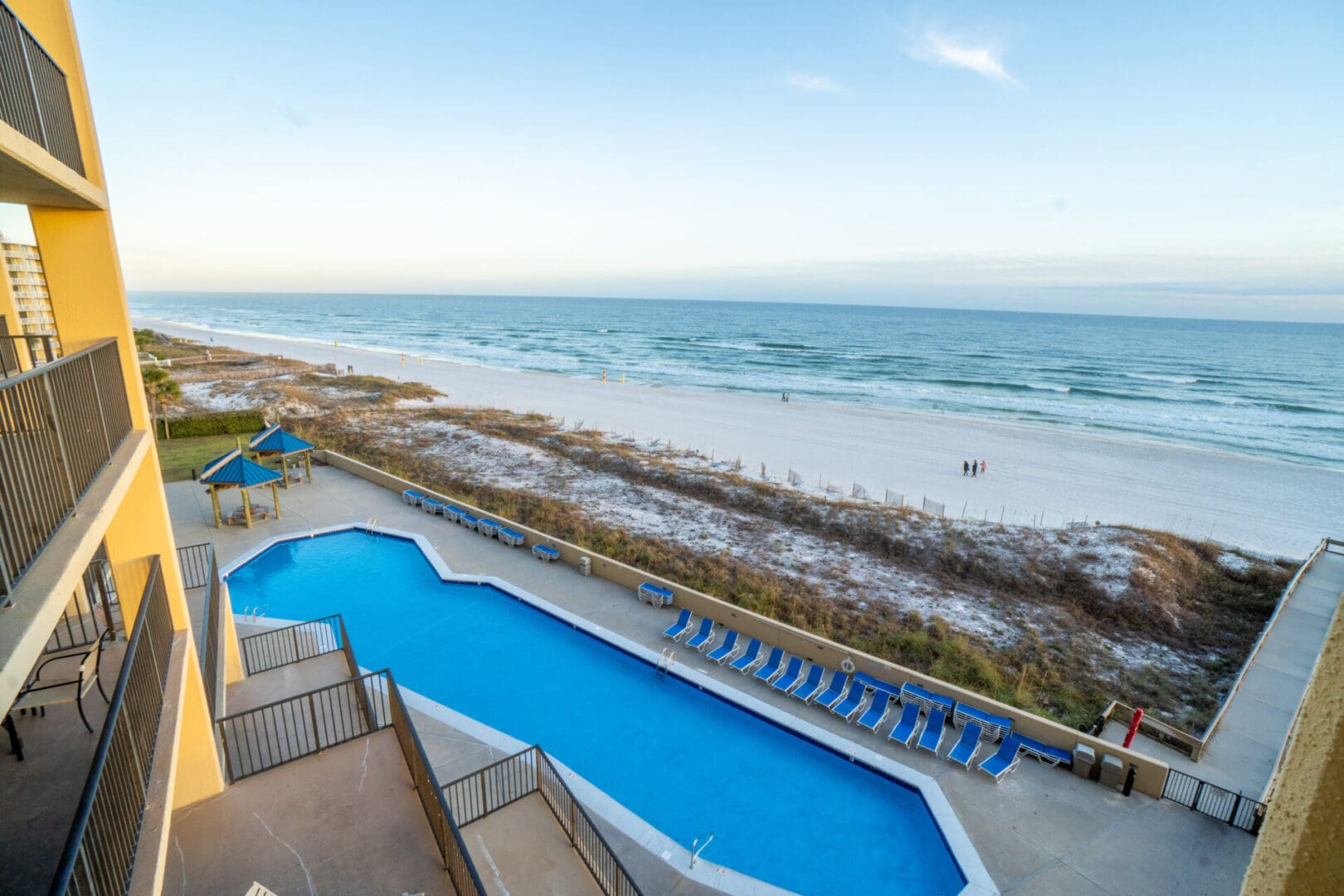 A view of the beach from above of a pool.