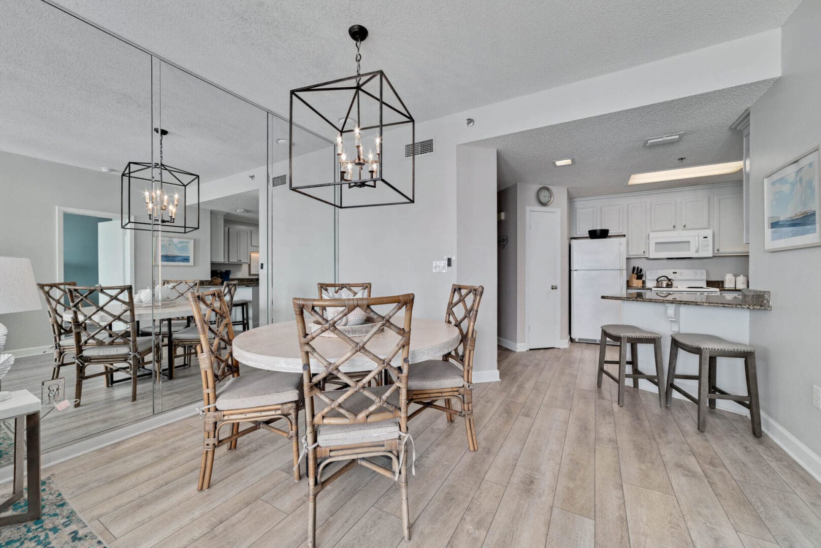 A dining room with a table and chairs in it