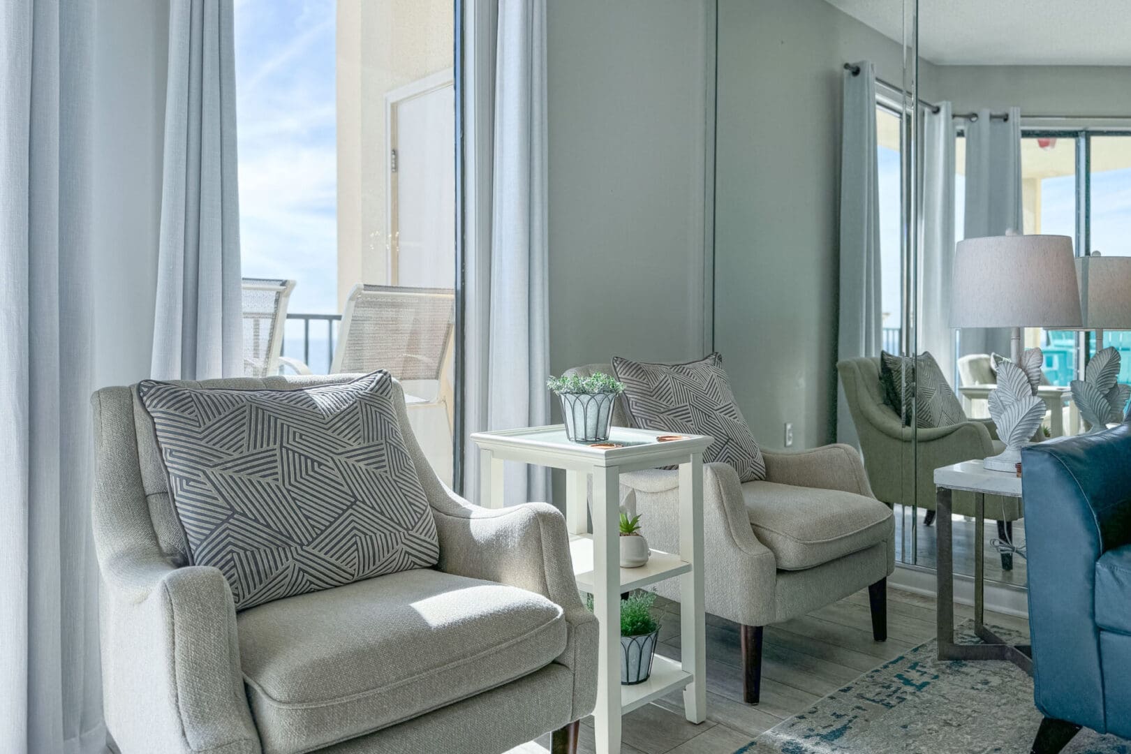 A living room with two chairs and a table