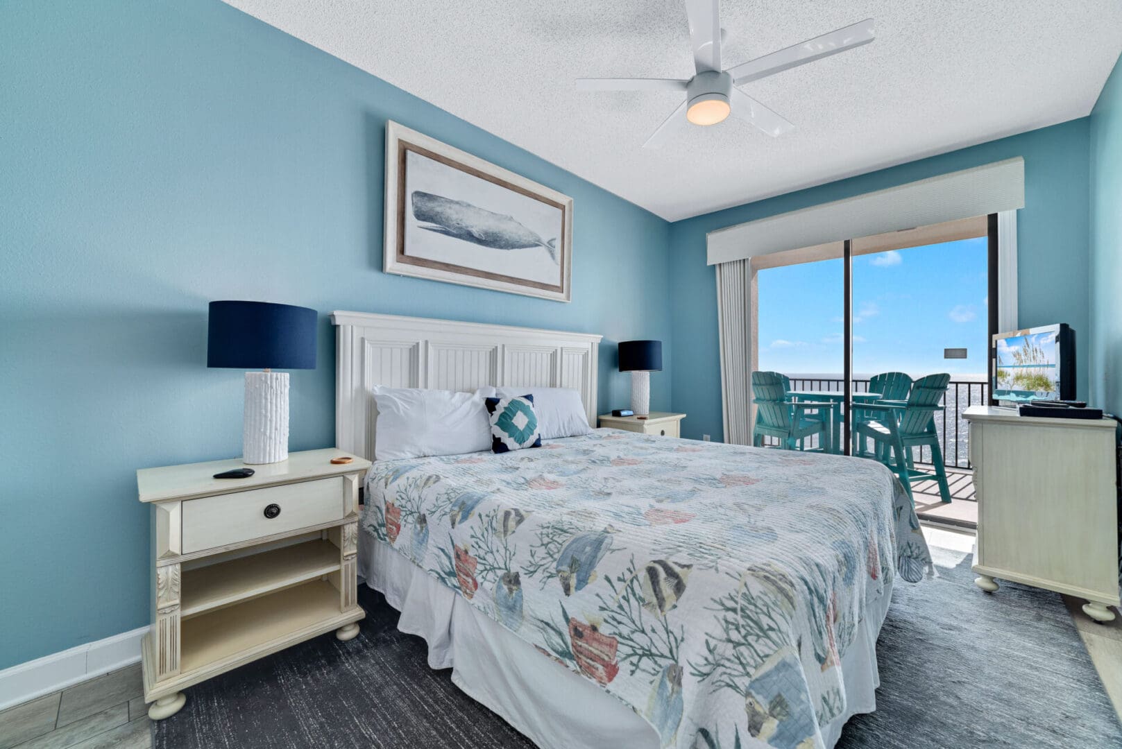 A bedroom with a bed, nightstand and window.