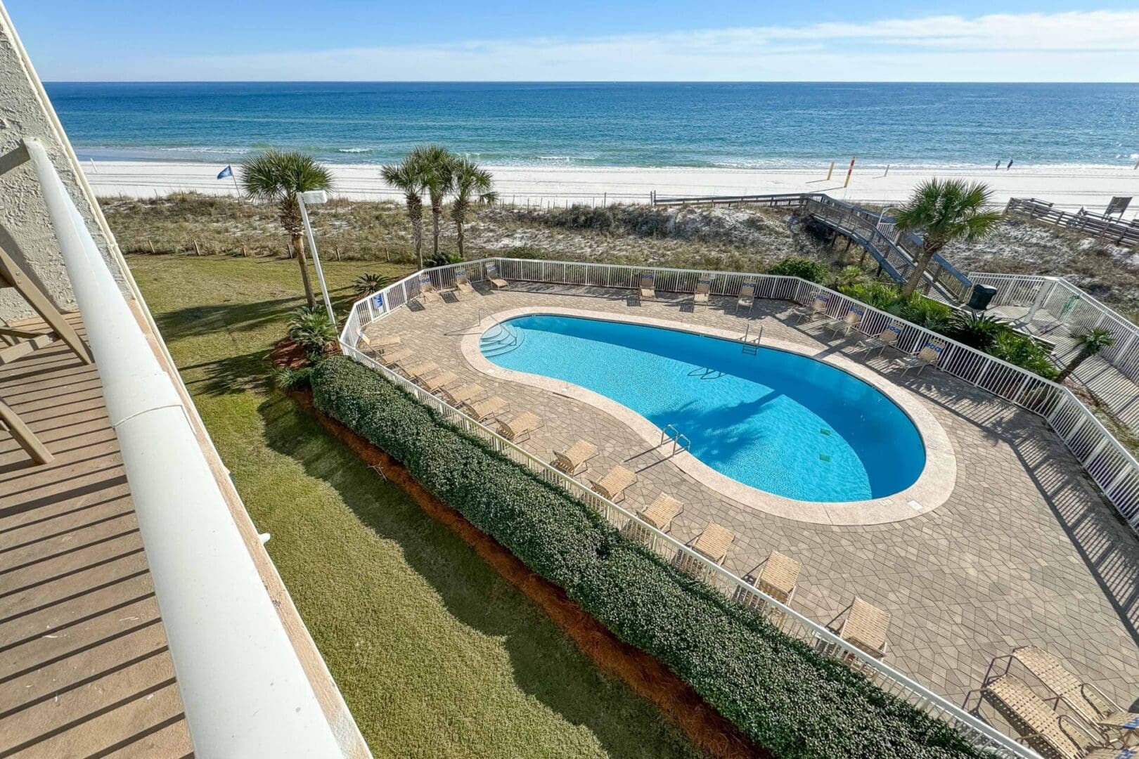 A pool that is in the middle of some grass.