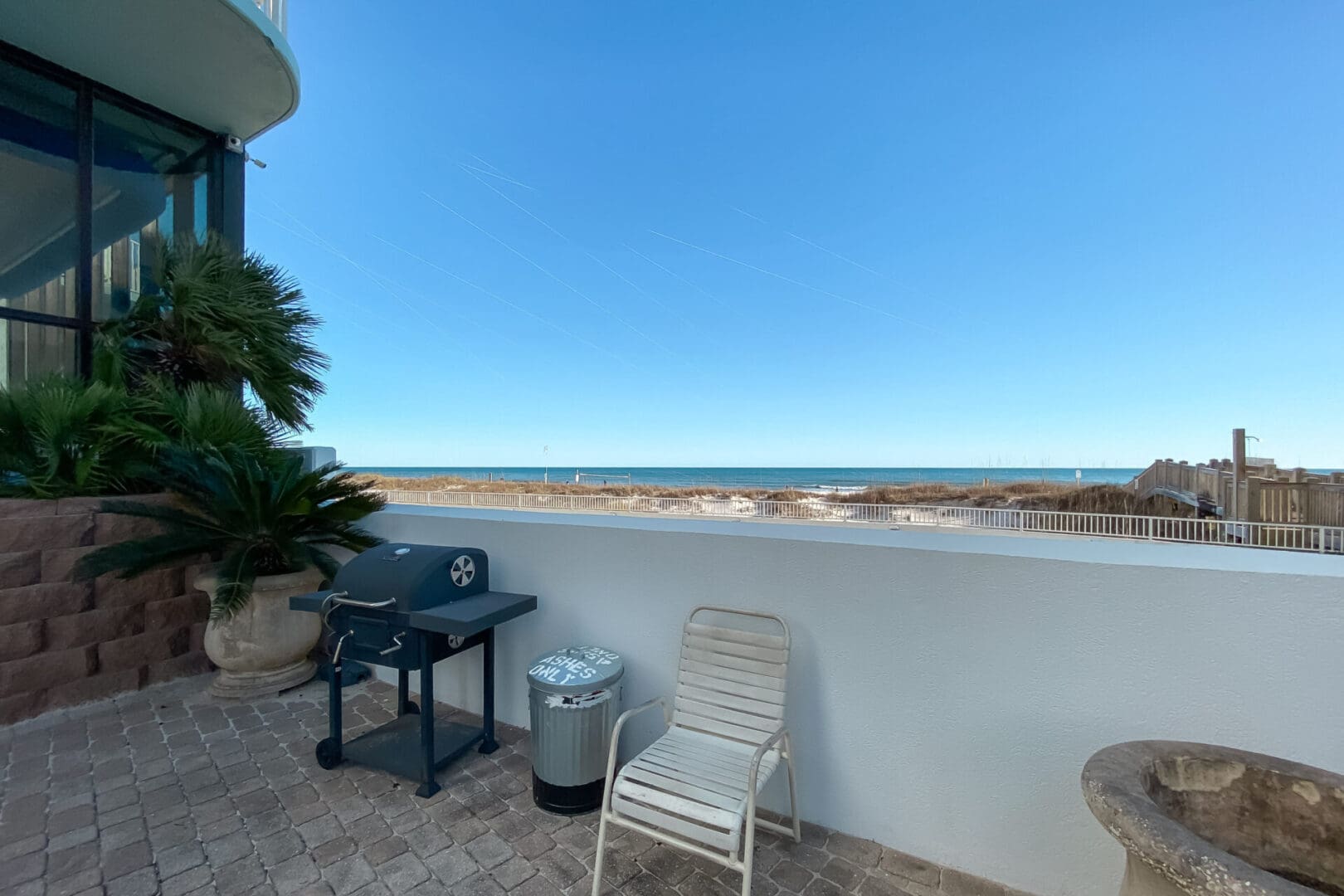 A view of the beach from an outside patio.