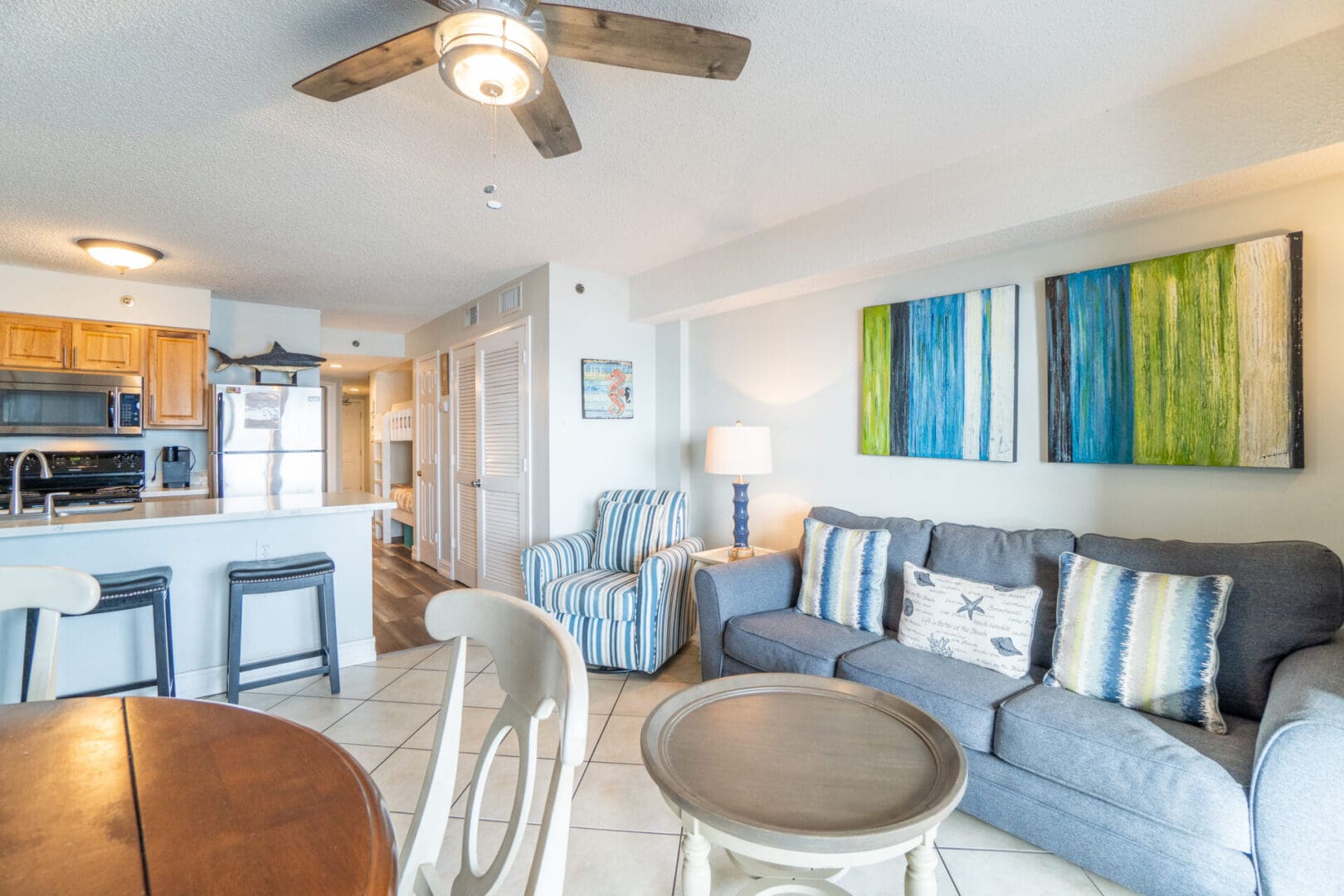 A living room with blue and white furniture.