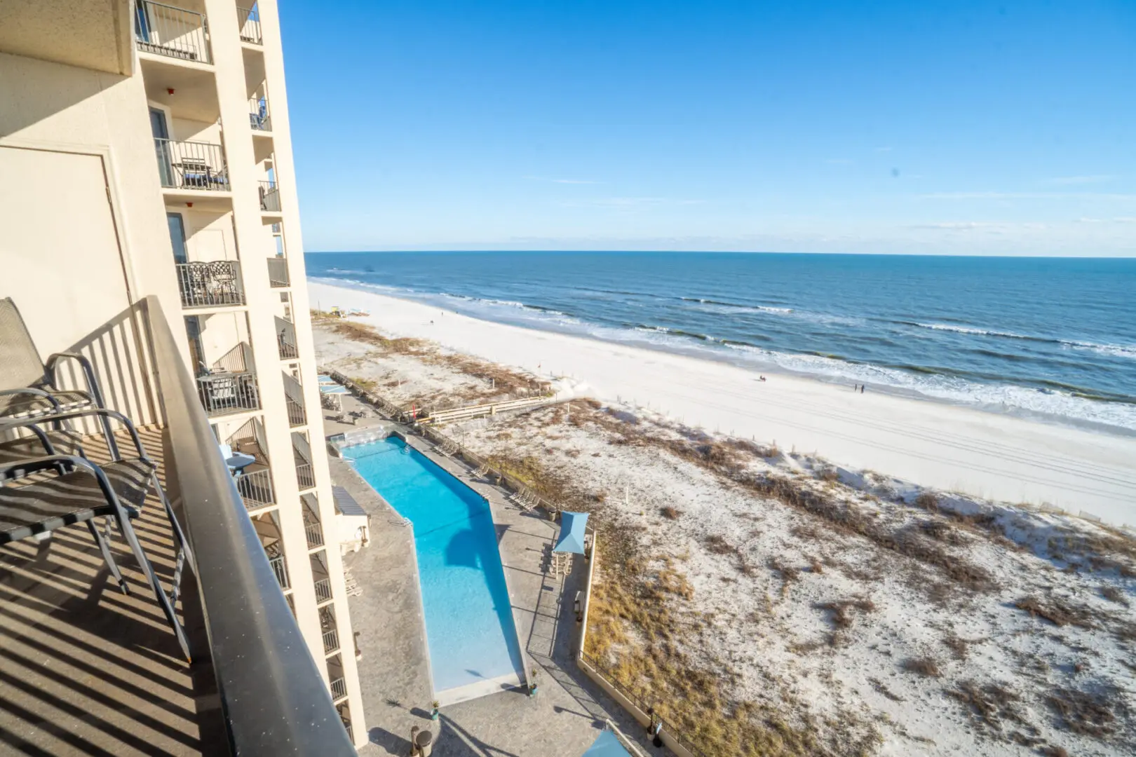 A view of the beach from an ocean front hotel room.