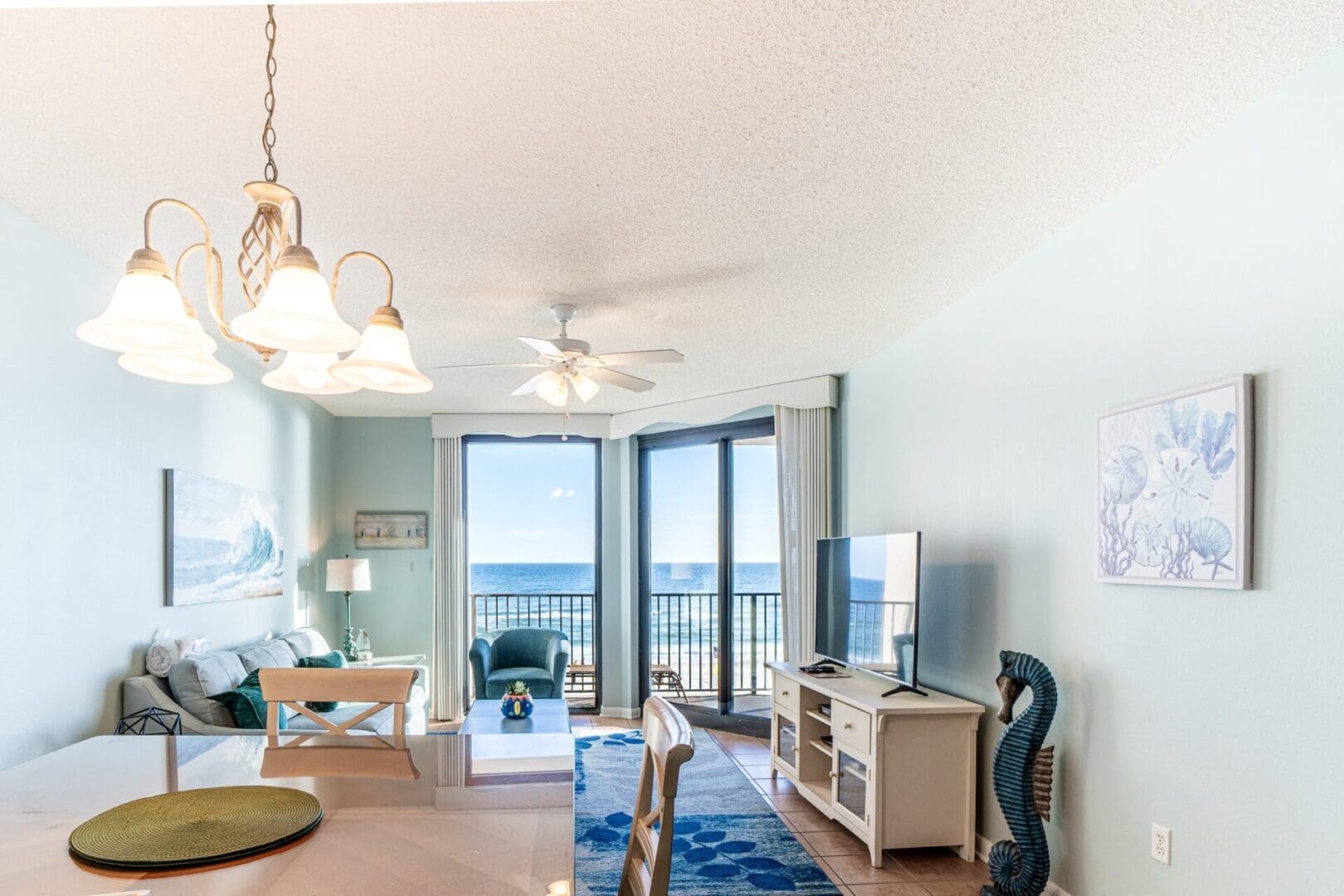 A living room with a view of the ocean.