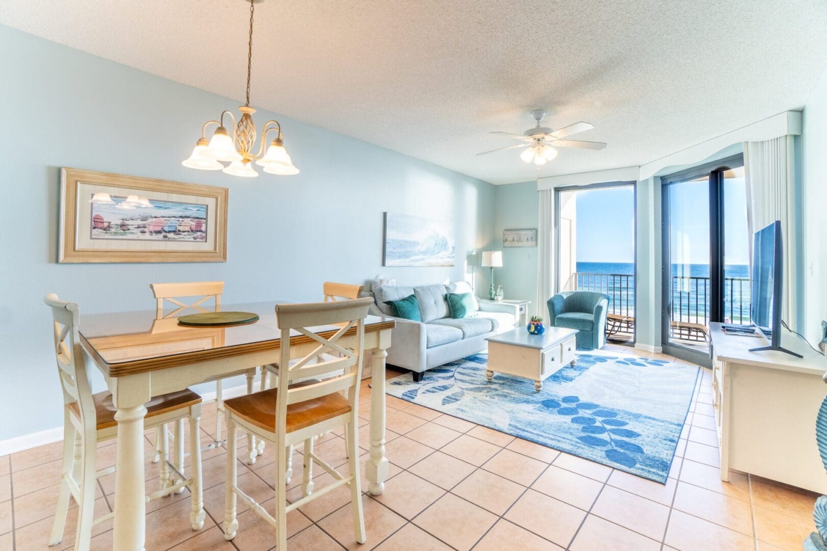 A living room with a dining table and chairs