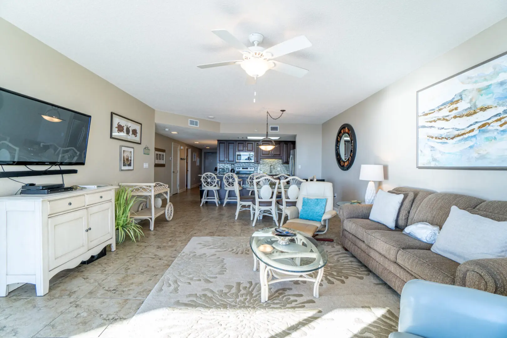 A living room with chairs and tables in it